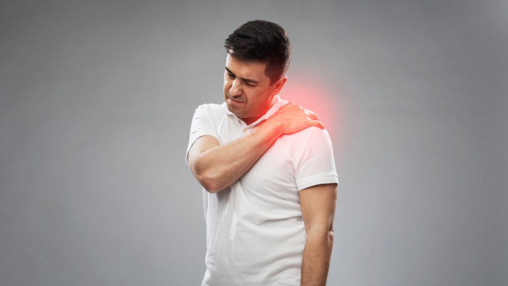 a man experiencing pain in his shoulder